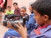 Boy holding video camera